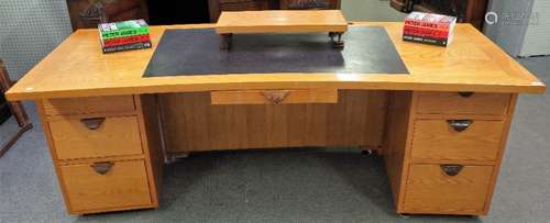 Peter James; from his study in West Sussex, a modern concave oak pedestal desk,