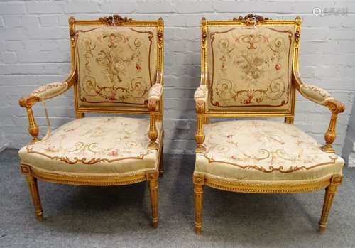 A pair of Louis XV style gilt framed square back open armchairs with bow seats on tapering fluted