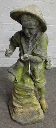 A lead figure group of a young boy fishing, 80cm high.