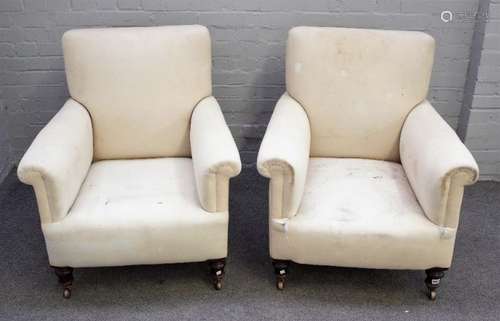 A pair of late 19th century square back easy armchairs, with patterned loose upholstery,