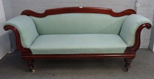 A George IV mahogany framed roll-end sofa, on turned supports, 210cm wide x 96cm high.