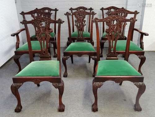 A set of eight 18th century style hardwood Chippendale revival dining chairs on claw and ball feet,