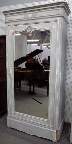 A French 19th century grey painted single mirrored door wardrobe with hidden drawer base,