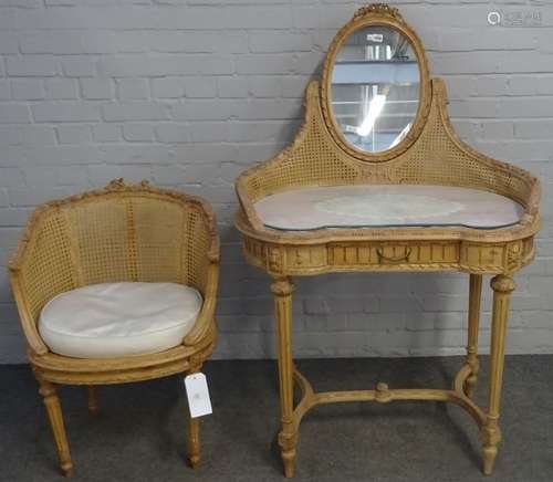 A Louis XVI style carved beech and cane work kidney shaped mirrored back dressing table,