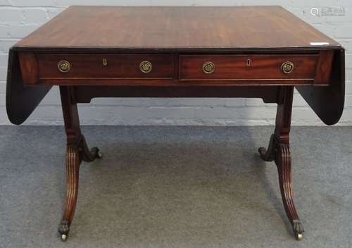 A George III mahogany sofa table, with opposing opposite frieze drawers, on four downswept supports,