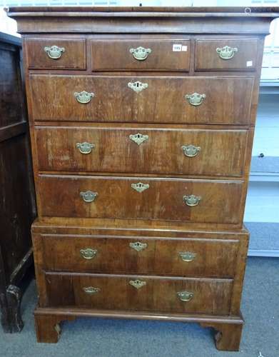 A George II figured walnut chest on chest with three short over five long graduated drawers on