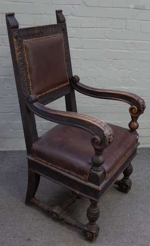 A 19th century Continental walnut open armchair with square back and beast head finials,