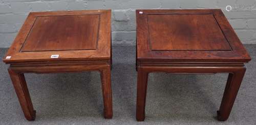 A pair of early 20th century Chinese hardwood square occasional tables on block supports,