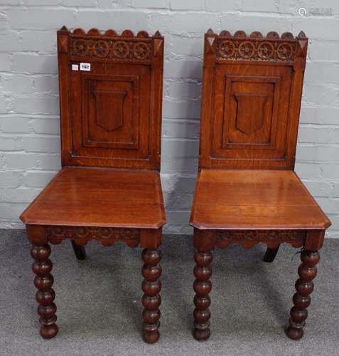 A pair of Victorian oak Gothic revival hall chairs,