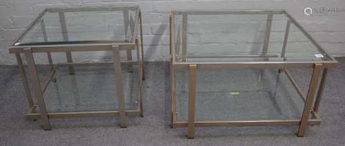 A graduated pair of 20th century polished chrome and bevelled glass two tier occasional tables,