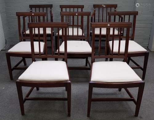 A set of eight George III mahogany stick back dining chairs on tapering square supports,