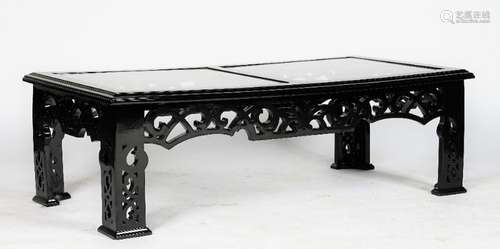 A black high gloss rectangular low cocktail table, in Chinese style, with fretwork friezes and legs,