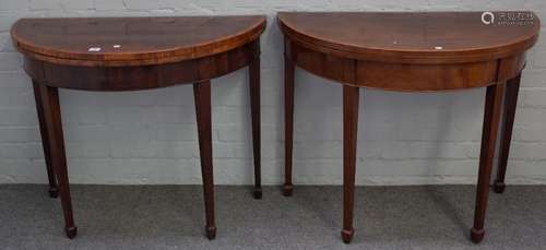 A near pair of George III kingwood banded mahogany 'D' shaped card tables on tapering square