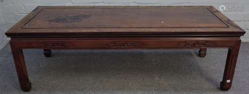 A graduated pair of early 20th century Chinese hardwood rectangular coffee tables on block supports,