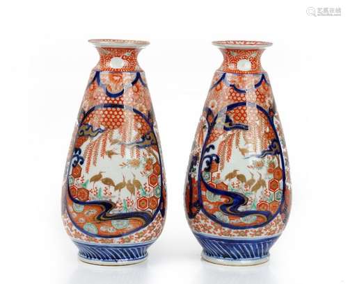 A pair of Japanese Imari vases, Meiji period, of tapered cylindrical form,