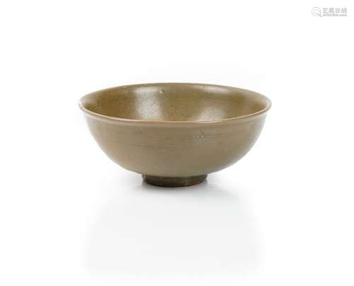 A Chinese celadon bowl, Yuan/Ming dynasty, covered in a deep olive green glaze, 19cm diameter.