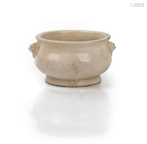 A Chinese white pottery censer, probably 17th/18th century, of bombé form with lion mask handles,