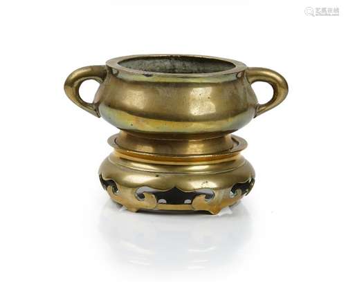 A Chinese polished bronze two-handled censer and stand, six character Xuande mark but later,