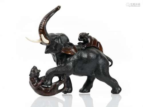 A Japanese bronze group of an elephant being attacked by two tigers, Meiji period, ivory tusks,