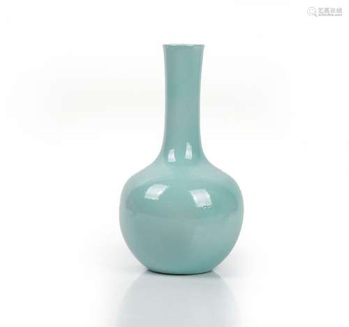 A Chinese porcelain bottle vase, 20th century, covered in a pale blue glaze, 25cm high.