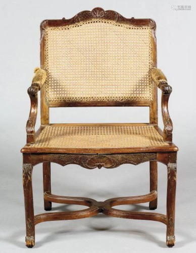 A FLAT BACK ARM CHAIR