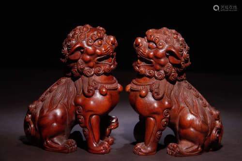 PAIR OF HUANGYANG WOOD CARVED LION ORNAMENT