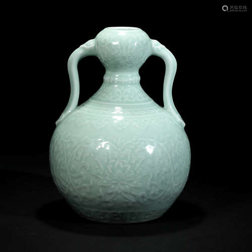 A Pea Green Glaze Lotus Pattern Carved Porcelain Ribbon Vase