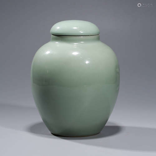 A CELEDON-GLAZED PORCELAIN JAR AND COVER