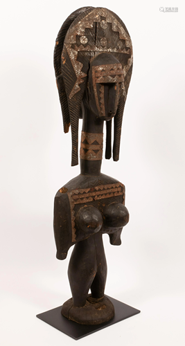 AFRICAN CARVED WOOD, PIGMENT AND METAL STANDING FE…