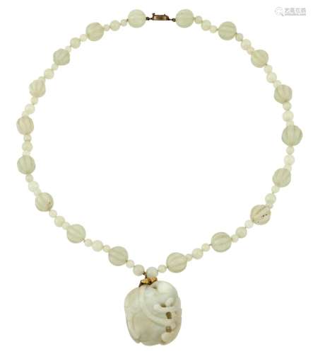 A Chinese Carved White Jade Pendant and Beaded Necklace