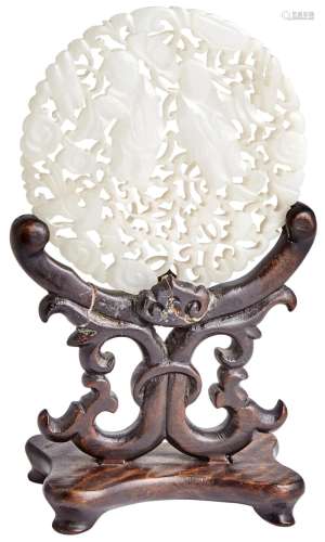 A Chinese White Jade Reticulated Round Plaque