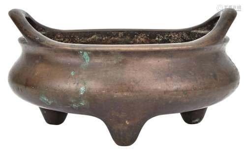 A Large Chinese Bronze Tripod Censer Xuande mark, 17th-18th century The compressed globular body raised on three taperin...