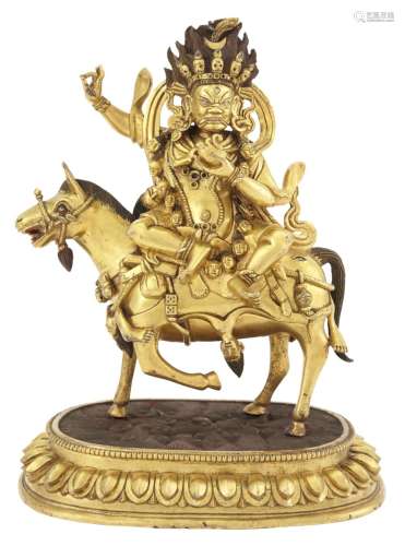 A Tibetan Gilt Bronze Figure of Mahakala on Horseback