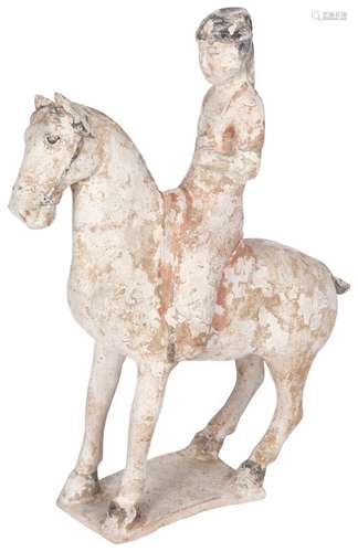 A Chinese Polychrome Decorated Pottery Figure of a Horse and Rider