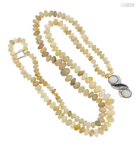 An opal, sapphire and diamond necklace, composed of two rows of bouton shaped opal beads to an