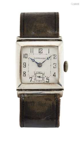 An Art Deco silver wristwatch, retailed by Garrard, the square off-white dial with Arabic black