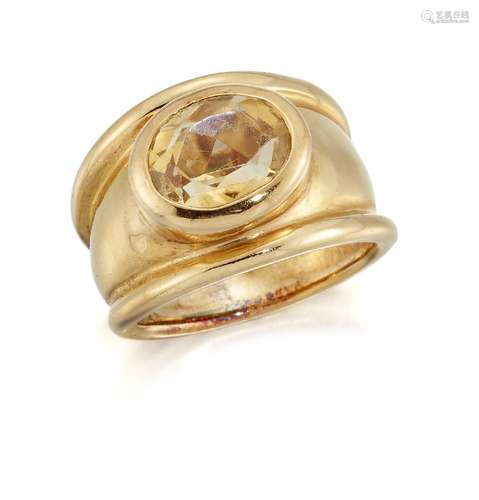 A citrine single stone ring, the oval citrine collet to a broad tapering hoop, ring size JPlease