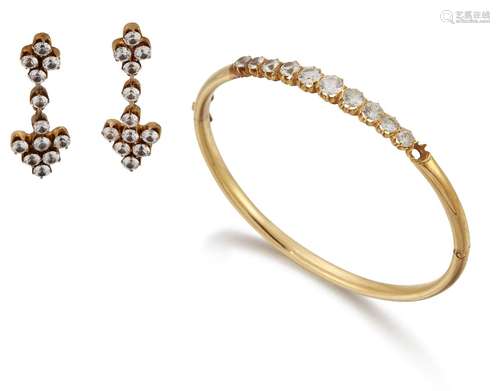 A cubic zirconia bangle and earrings, the hinged half-hoop bangle composed of a graduated line of