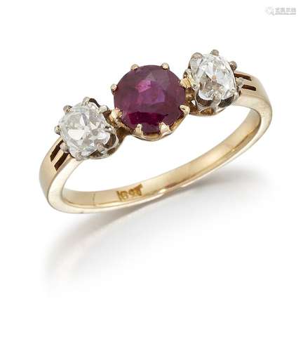 A ruby and diamond three stone ring, the central circular-cut ruby between old mine-cut diamond