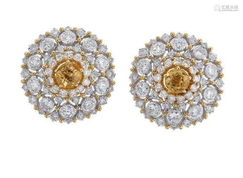 A pair of diamond and citrine earrings, each circular citrine within a brilliant-cut diamond pierced