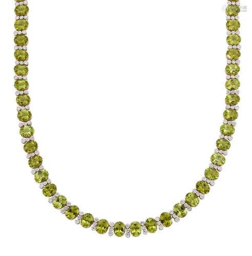 A peridot and diamond necklace, composed of a line of oval peridots with brilliant-cut diamond three