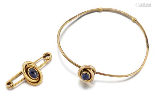 A late 19th / early 20th century gold and sapphire single stone bangle and bar brooch, the bangle