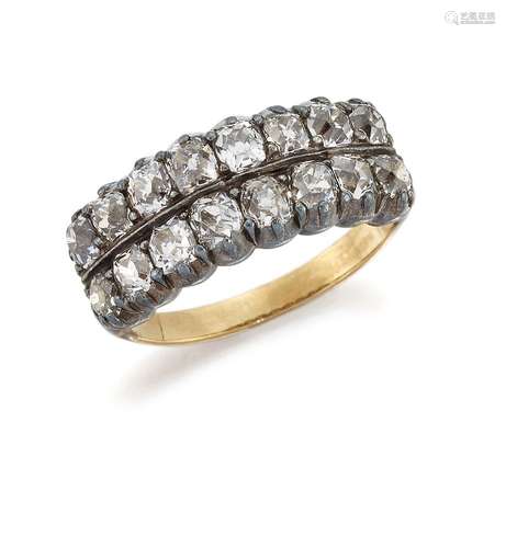 A late Victorian diamond half-hoop ring, set with two rows of old-cut diamonds mounted in gold and