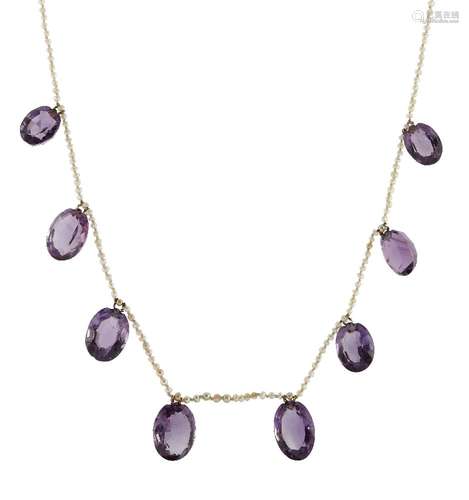 An amethyst and seed pearl necklace, the seed pearl necklace suspending eight graduated oval