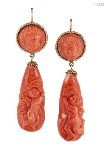 A pair of late 19th century coral earrings, each tapered drop carved with a putto, the circular tops