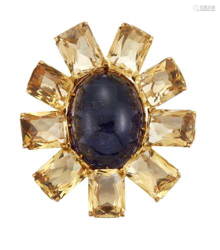 An 18ct gold citrine and iolite brooch, of stylised flowerhead design, the central oval cabochon