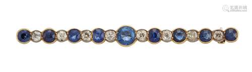 An early 20th century sapphire and diamond bar brooch, the central circular sapphire between lines