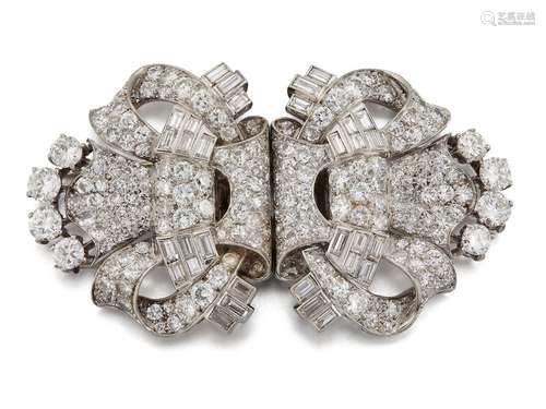 Two Art Deco platinum and diamond brooches, of matching shield shaped design composed of circular