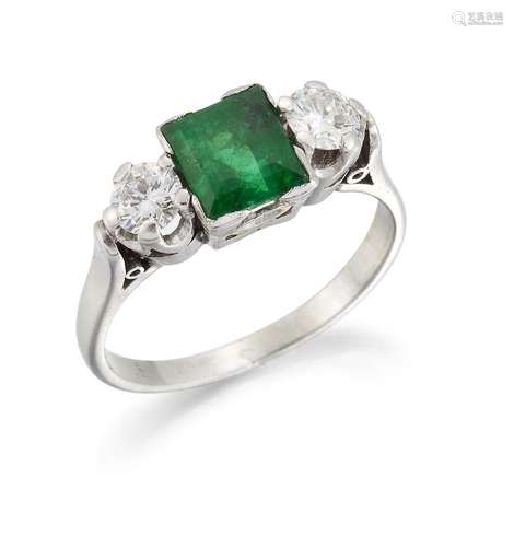 An emerald and diamond three stone ring, the square-cut emerald between brilliant-cut diamond single