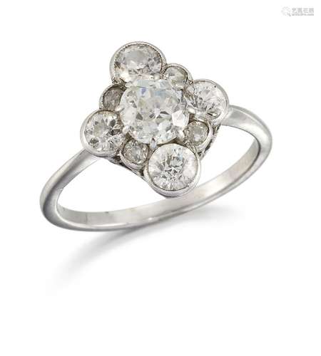 An early 20th century platinum and diamond cluster ring, of quatrefoil cluster design, set